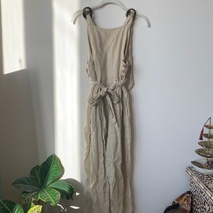 Free people jumpsuit with wood on sleeves and side